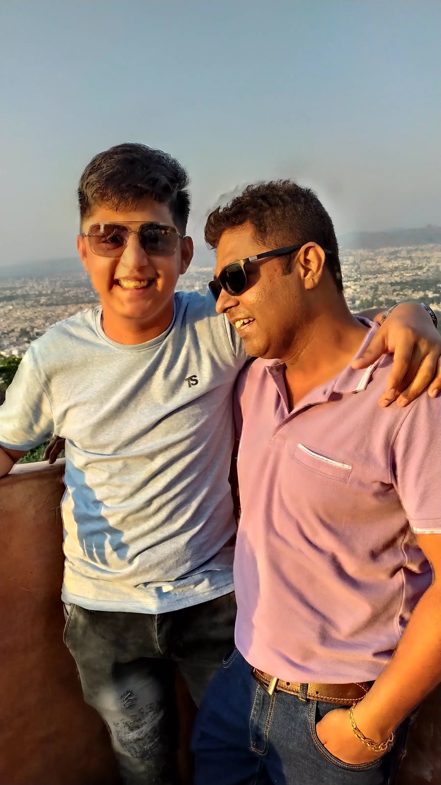 Dad and son smiling together